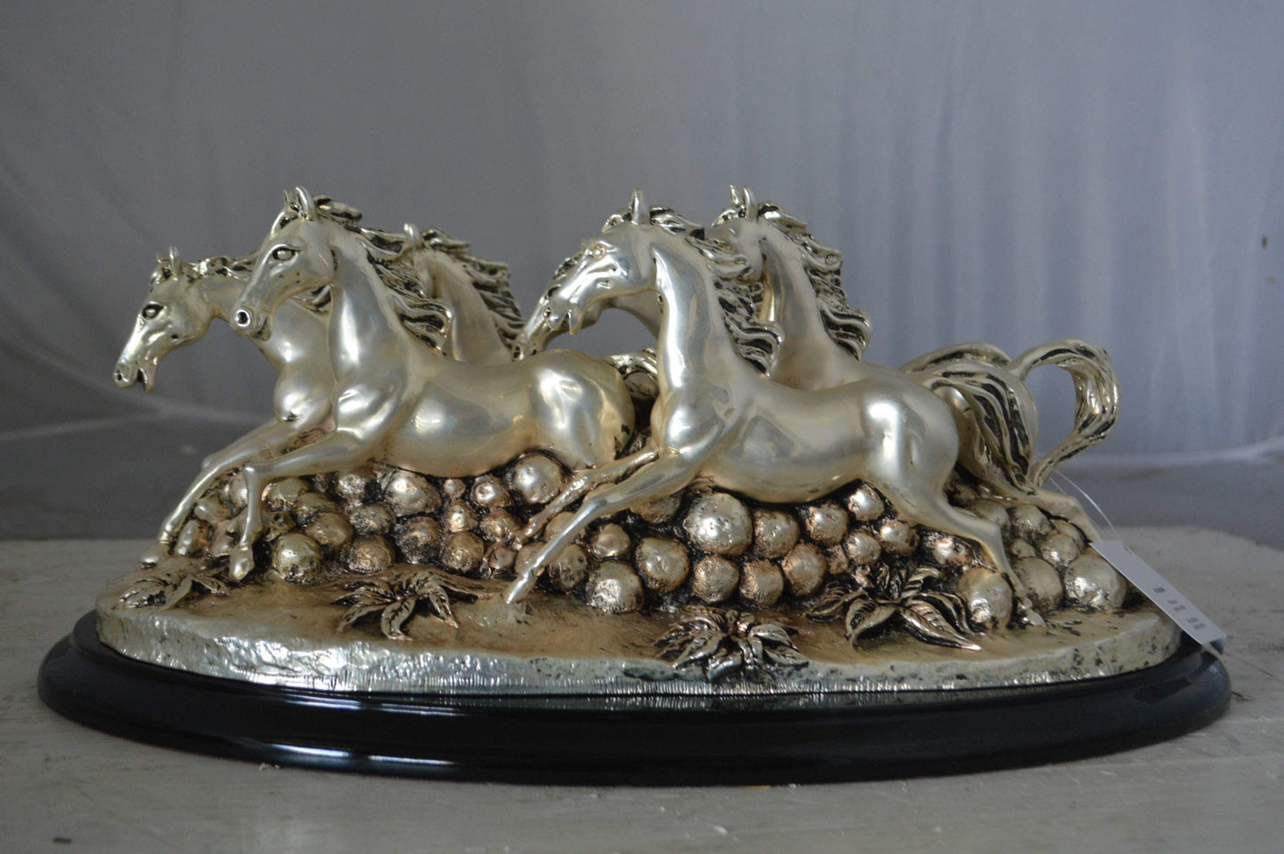Charging horses resin statue on wood base - Size: 17"L x 10"W x 5"H.
