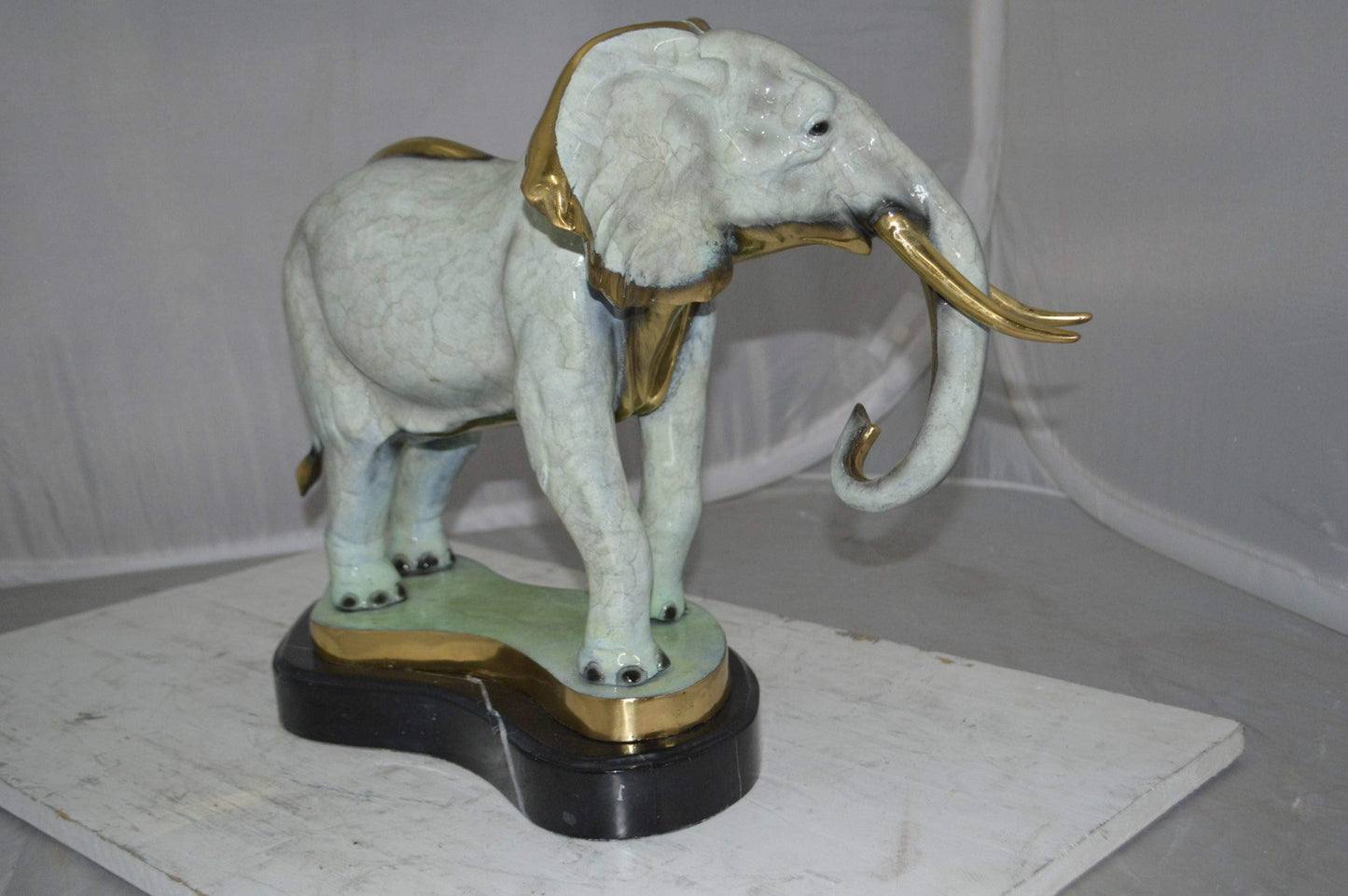 Elephant trunk Down Bronze Statue -  Size: 28"L x 12"W x 17"H.