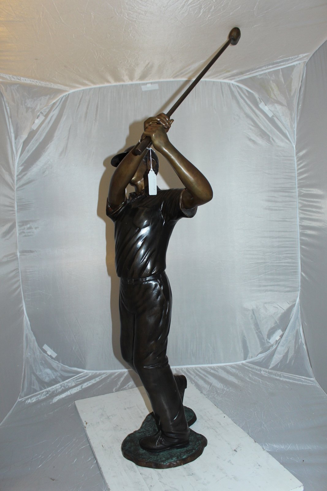 Teen boy plays golf Bronze Statue -  Size: 18"L x 13"W x 57"H.