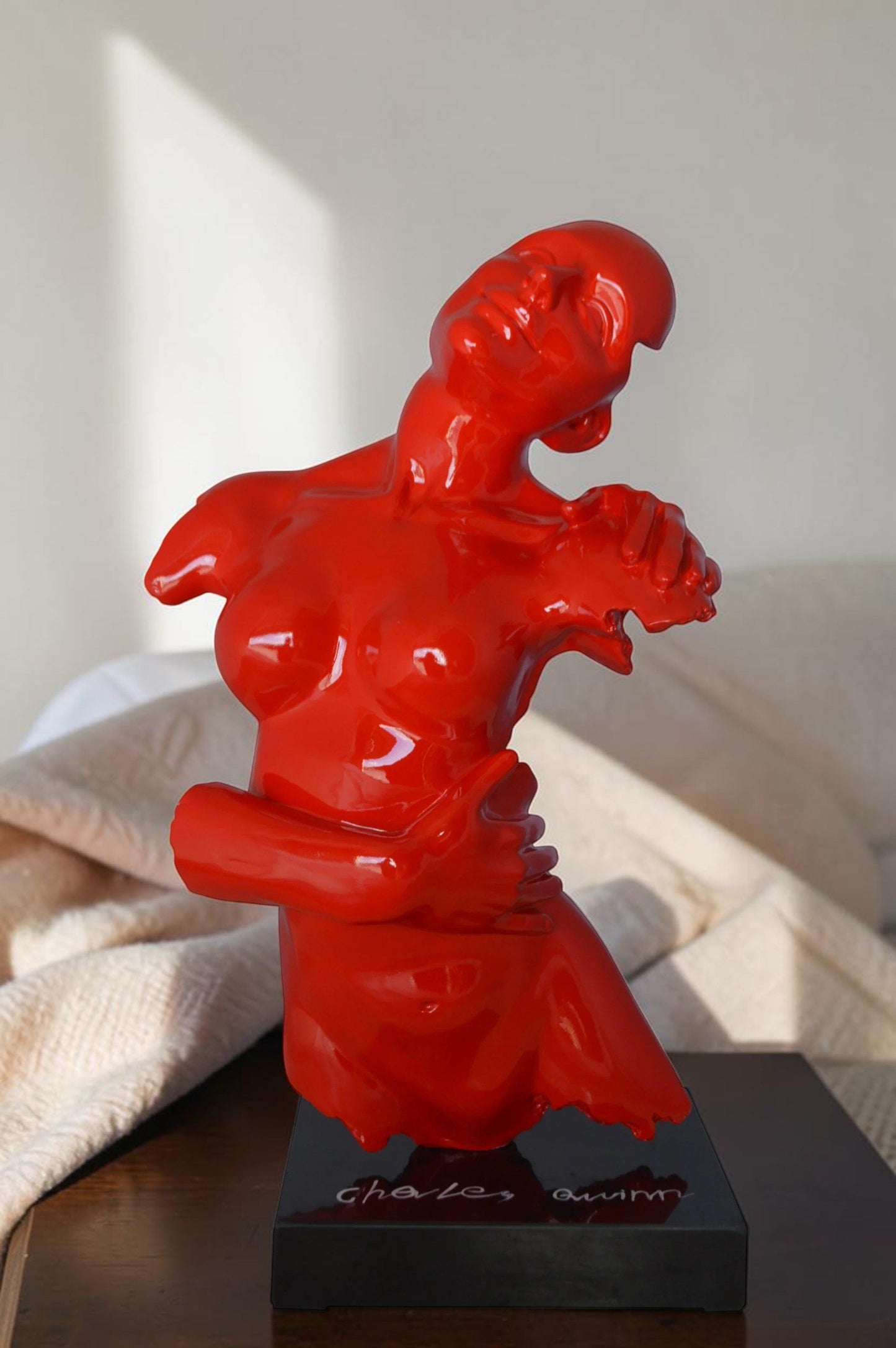 Modern resin statue of a woman hugged by a men -  Size: 13"L x 9"W x 24"H.