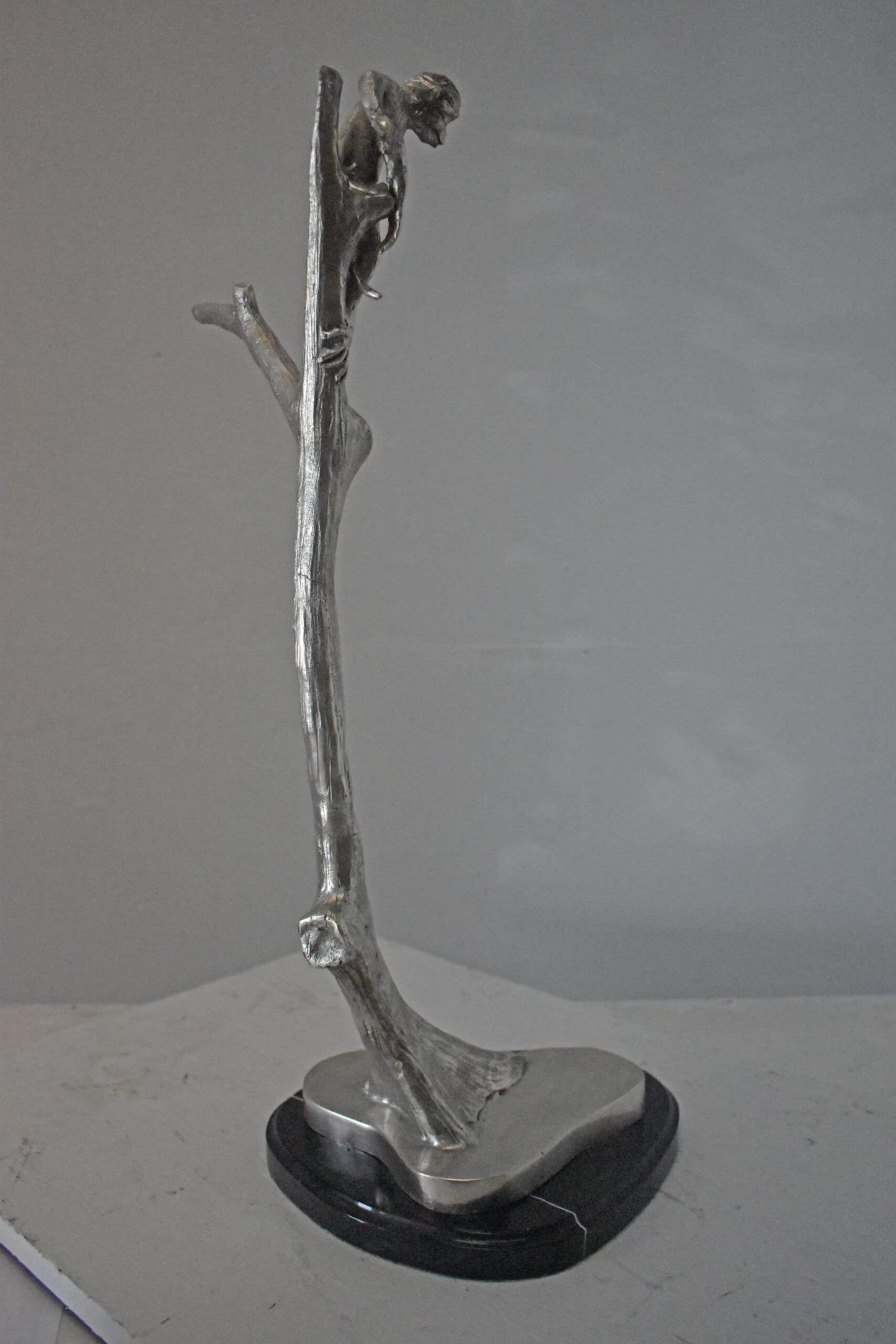 Monkey Resting on a Tree Silver Finish Bronze Statue - Size: 12" x 13" x 27"H.