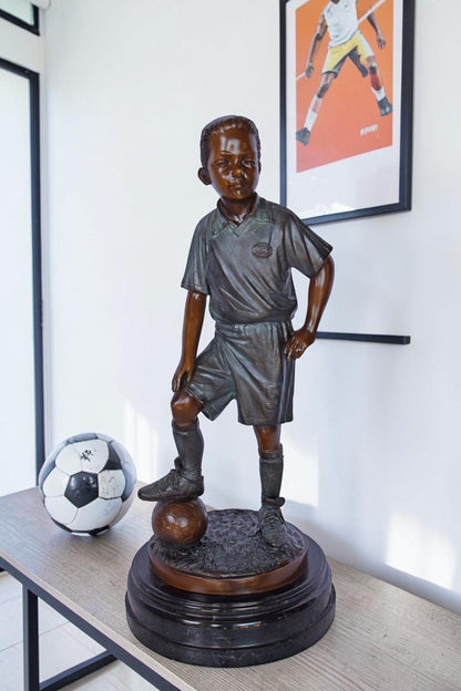 Soccer Boy Player in Action Bronze Statue on Marble - Size: 12"L x 12"W x 26"H.
