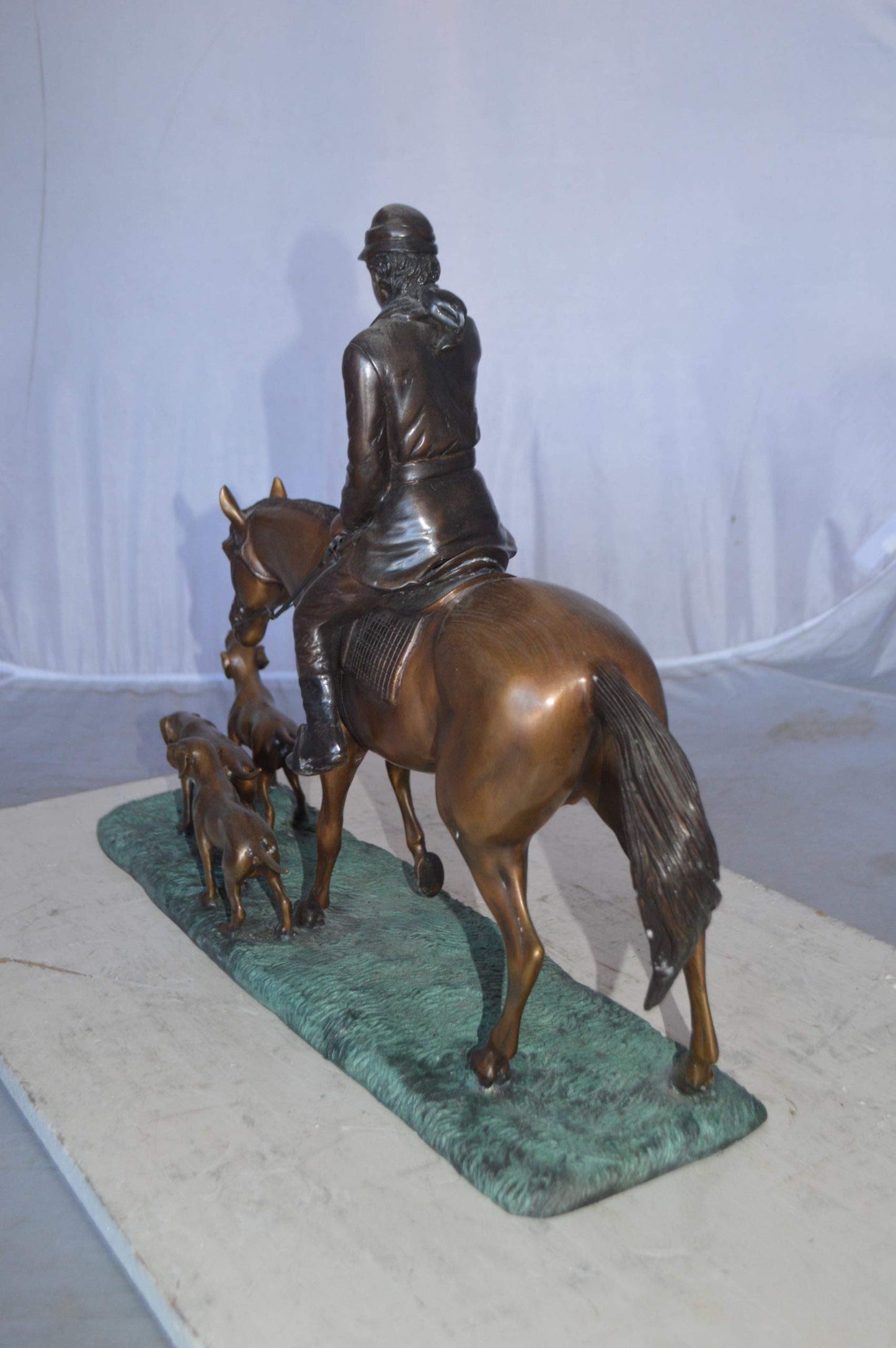 Hunter with three dogs Bronze Statue -  Size: 27"L x 6"W x 18"H.
