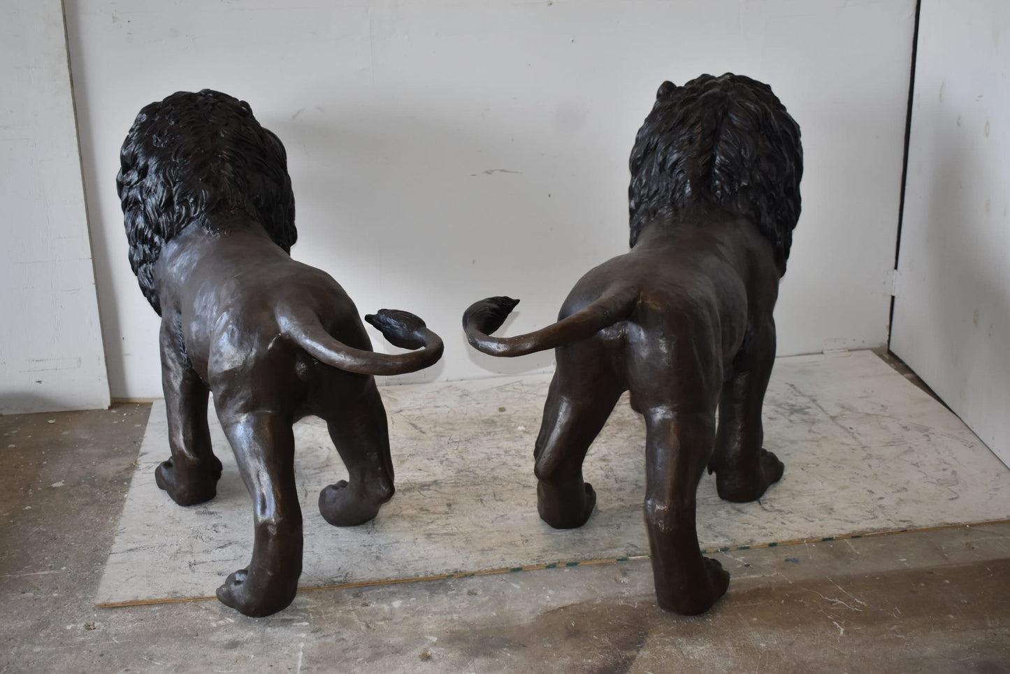 A Pair of Large Lions Walking Side by Side Bronze Statues Size: 24" x 60" x 41"H