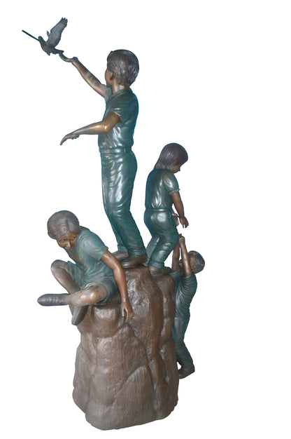 Four Kids Playing on a Rock Bronze Statue -  Size: 49"L x 26"W x 89"H.