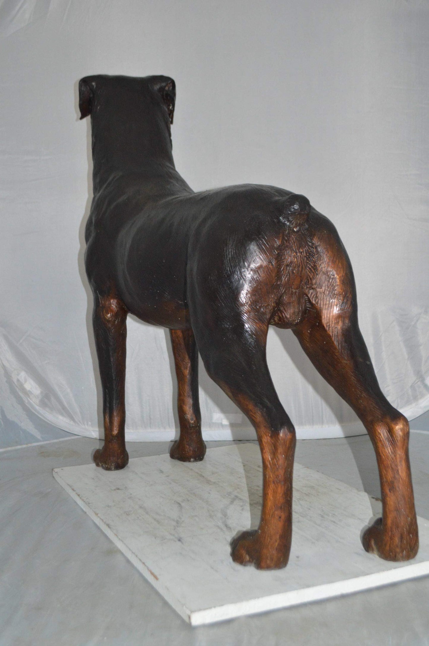 Rottweiler Dog Bronze Statue -  Size: 44"L x 10"W x 36"H.