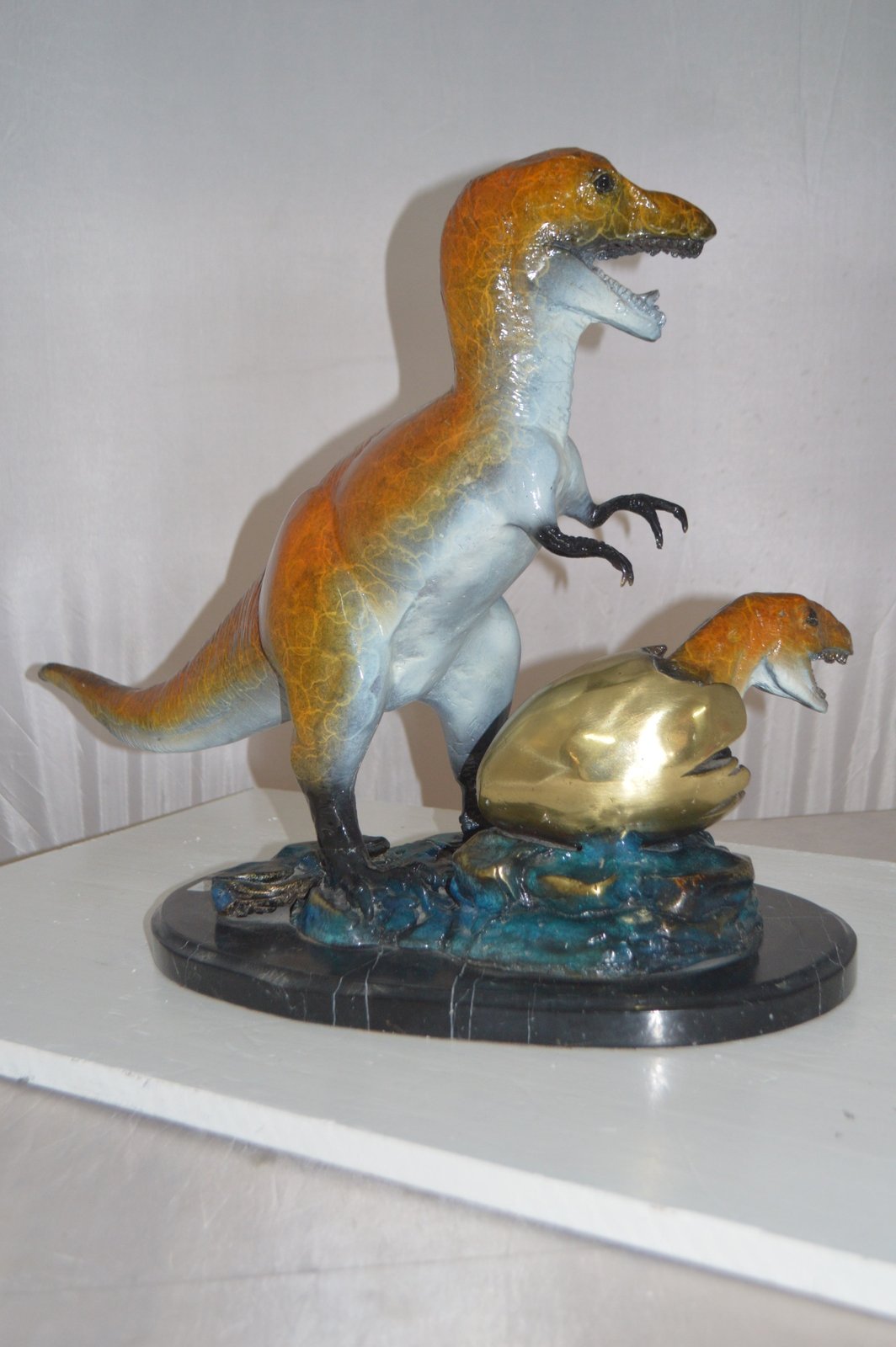 Dinosaur and baby Dino Bronze Statue -  Size: 26"L x 11"W x 18"H.