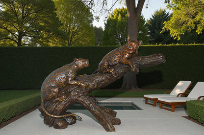 Two Jaguars On A Tree Bronze Statue - Size: 66"L x 34"W x 44"H.