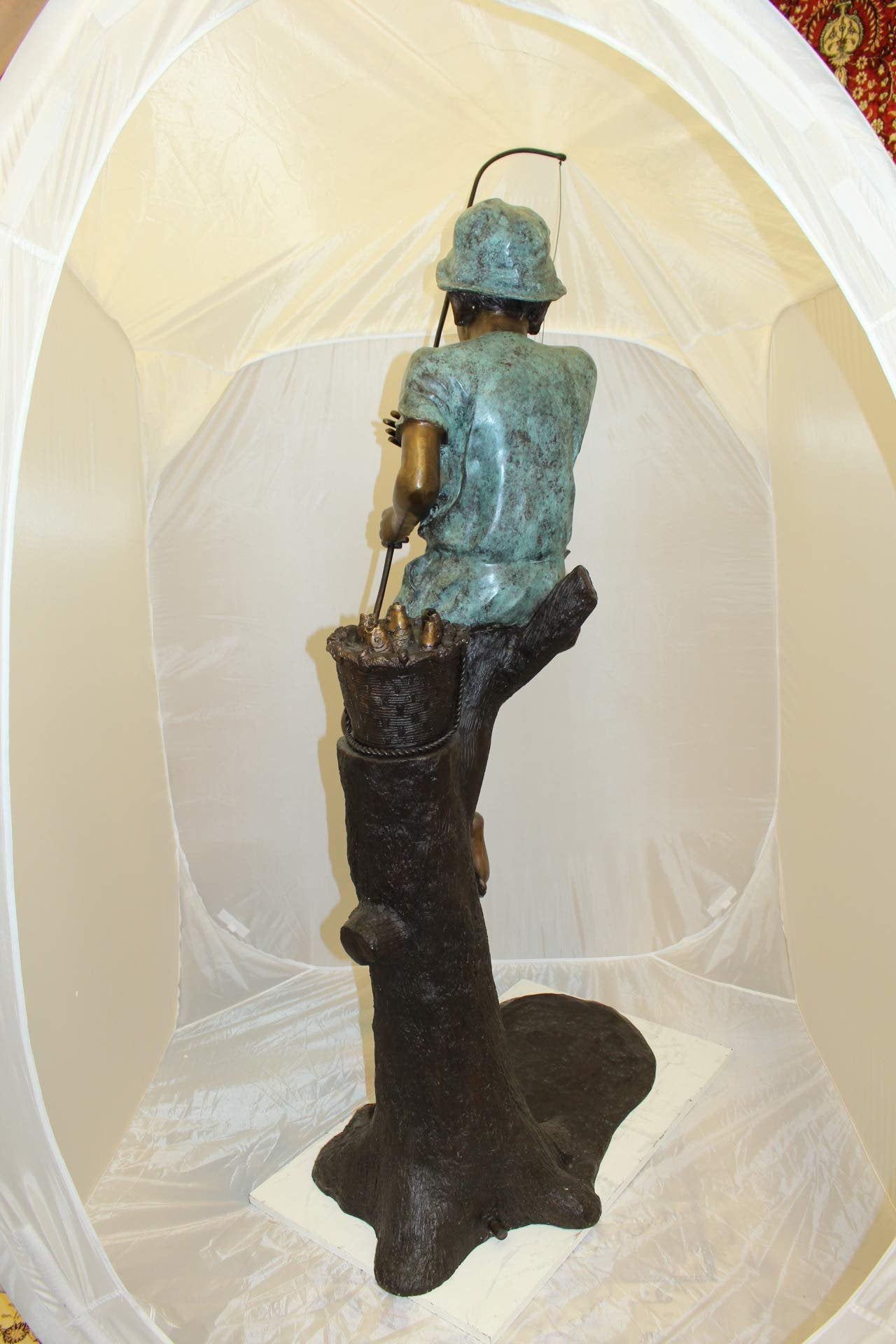 Boy Sitting on a Tree and Fishing Bronze Statue -  Size: 34"L x 28"W x 64"H.