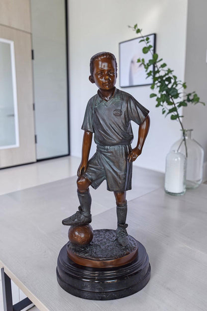 Soccer Boy Player in Action Bronze Statue on Marble - Size: 12"L x 12"W x 26"H.