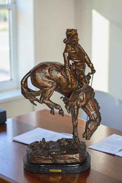 Outlaw by Remington Bronze Statue Replica - Size: 18"L x 10"W x 32"H.