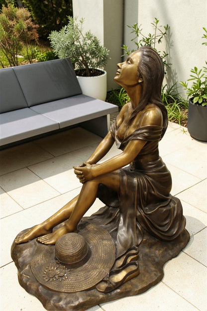 Lady on Stone Bronze Statue -  Size: 33"L x 23"W x 34"H.