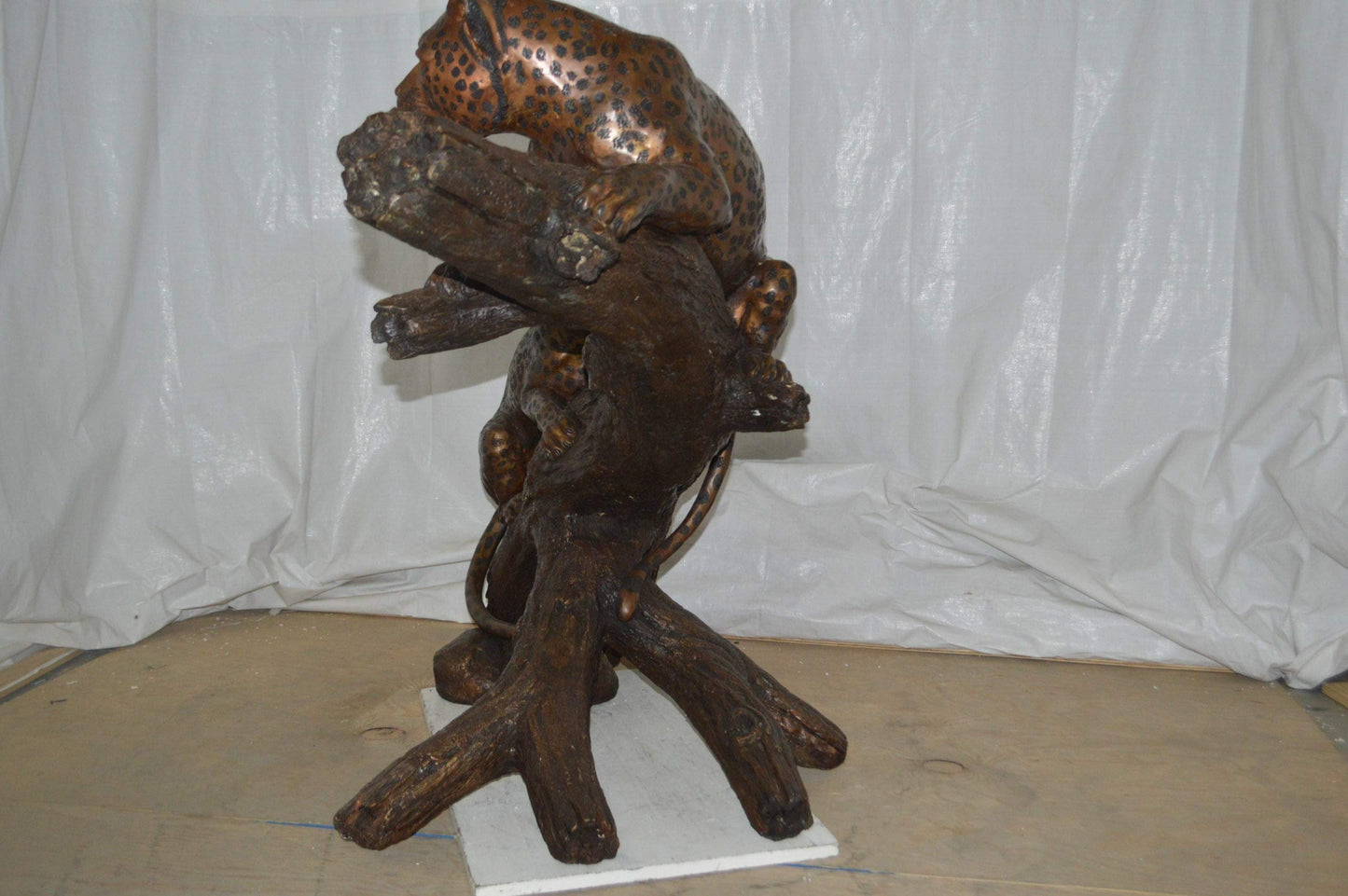 Two Jaguars On A Tree Bronze Statue - Size: 66"L x 34"W x 44"H.