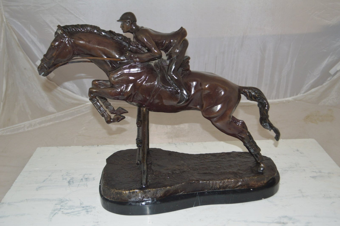 Jockey With Horse Jumping Over Hurdle Bronze Statue Medium  23"L x 10"W x 16"H.