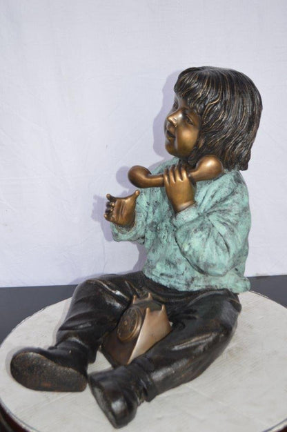 Young Child With an Old Telephone Bronze Statue -  Size: 21"L x 14"W x 19"H.
