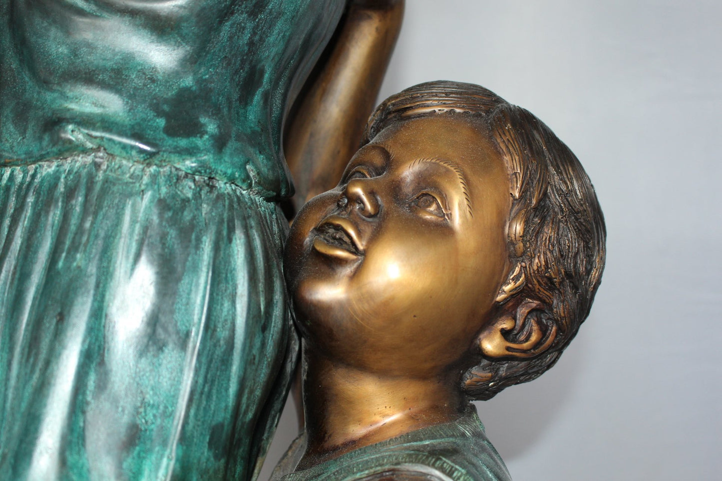 Two Kids Climbing on a Tree Bronze Statue -  Size: 17"L x 17"W x 46"H.