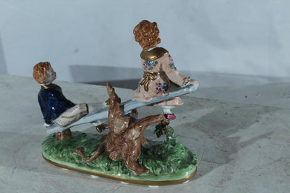 NIFAO Porcelain boy and Girl on Seesaw Figurine Vintage Style 10"x4"x9"H