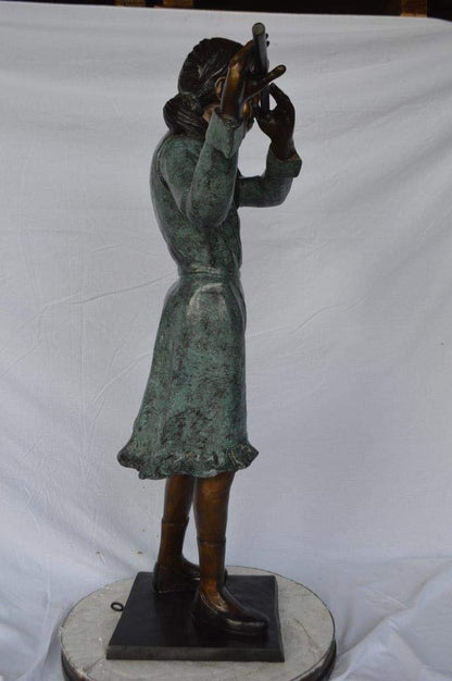 Girl playing flute large bronze statue -  Size: 30"L x 15"W x 50"H.