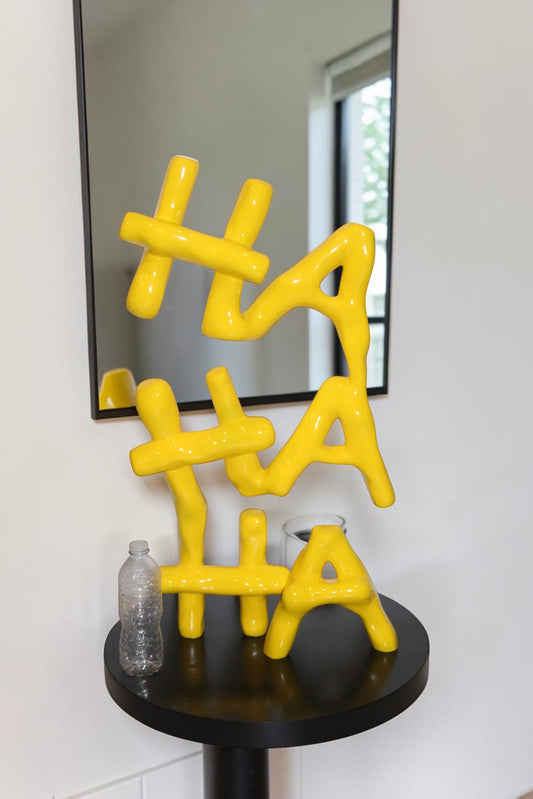 Yellow Pastel HA HA HA Resin Statue on Black Metal Base 20" x 20" x 31"H