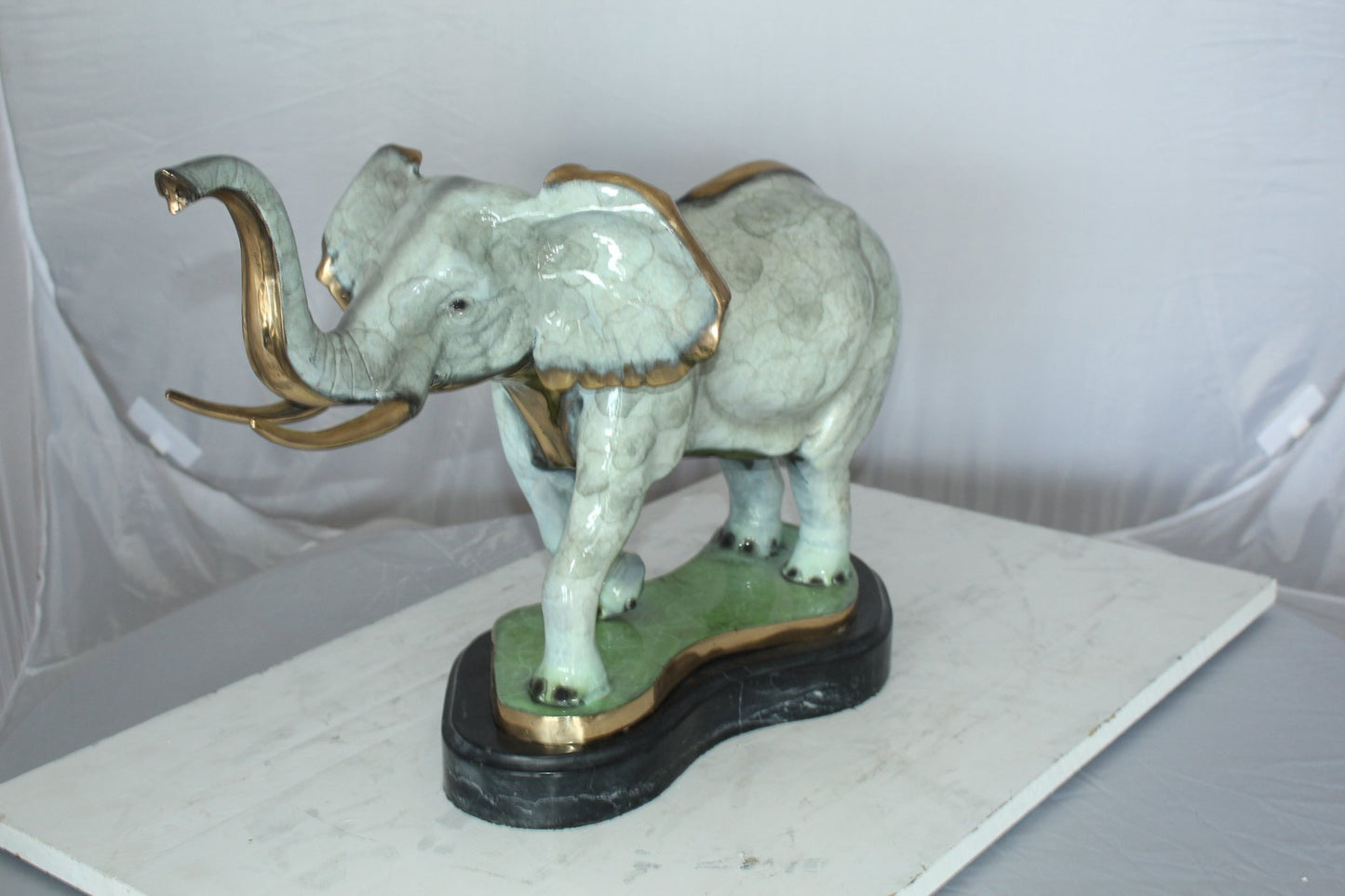 Elephant Medium Bronze Statue -  Size: 26"L x 8"W x 17"H.