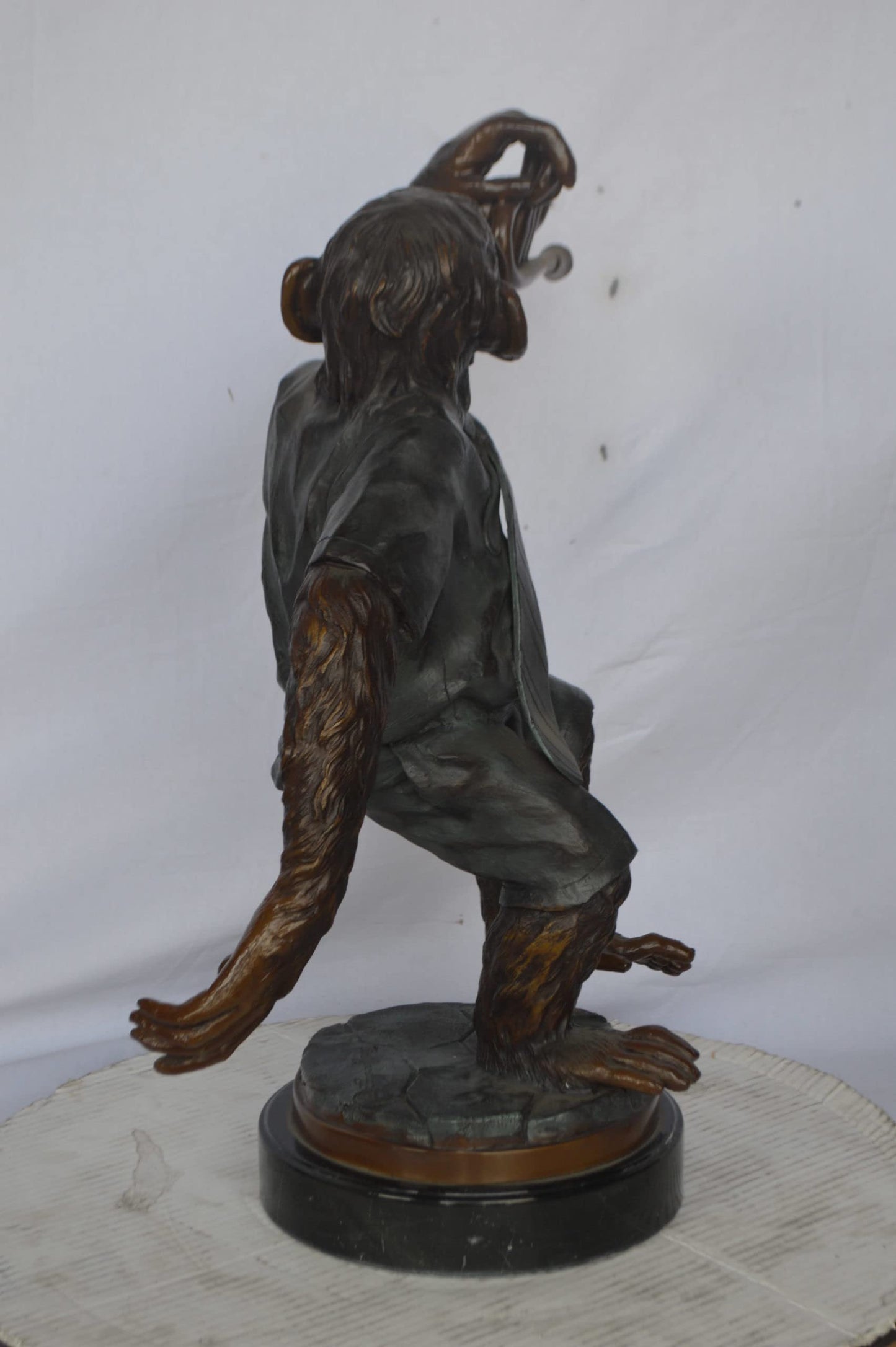 Monkey With Trumpet Bronze Statue - Size: 24"L x 12"W x 26"H.