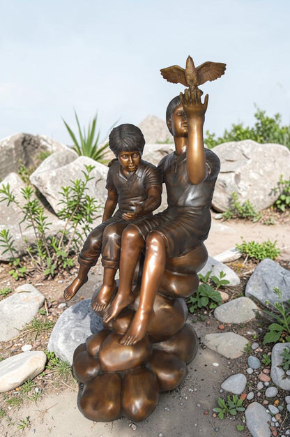 Two Kids on Rocks with a Bird Bronze Statue -  Size: 36"L x 30"W x 44"H.