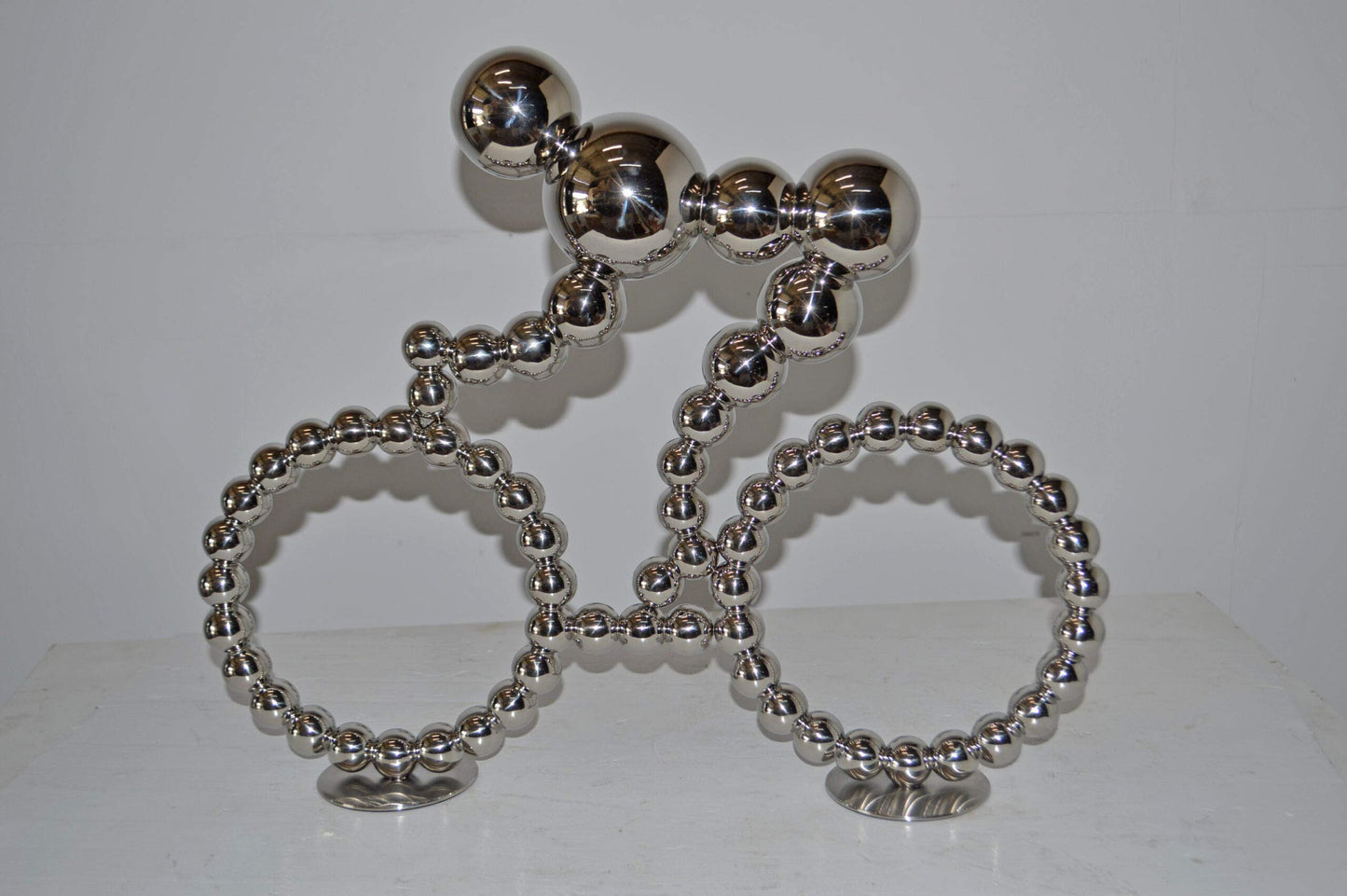 Modern Art Rider on His Bicycle Chrome Statue - Size: 22"L x 4"W x 17"H.