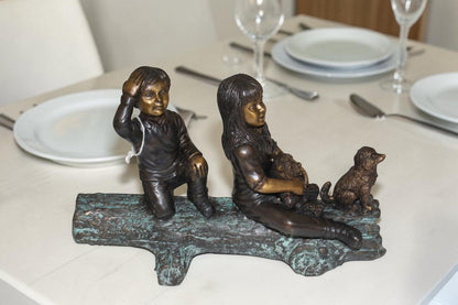 Two kids with dog on log Bronze Statue -  Size: 12"L x 5"W x 8.5"H.