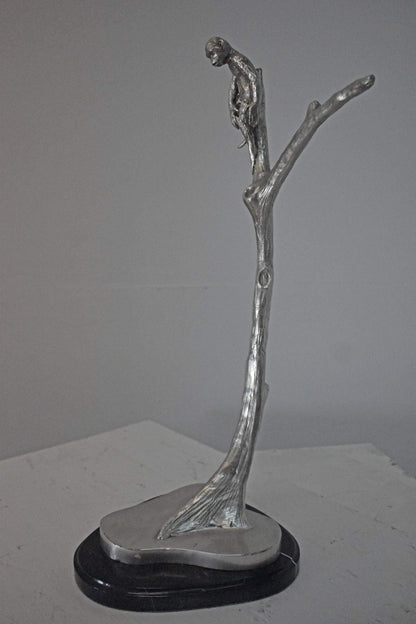 Monkey Resting on a Tree Silver Finish Bronze Statue - Size: 12" x 13" x 27"H.