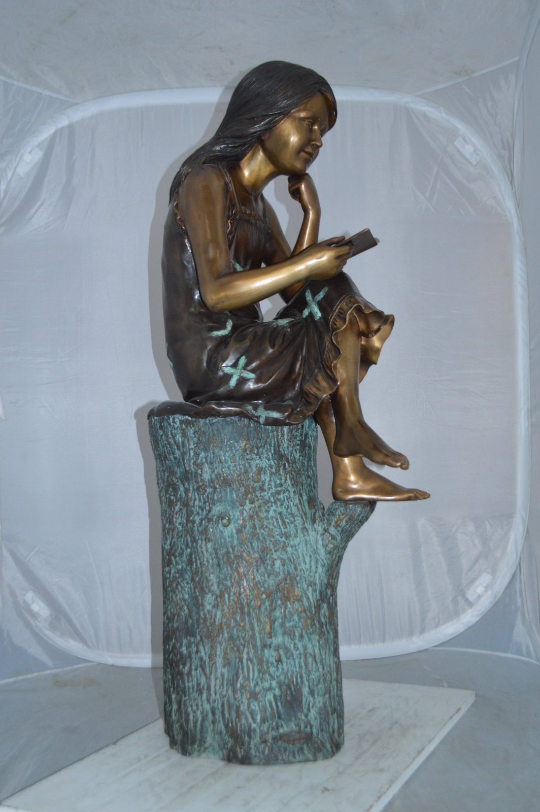 Sitting Girl on Log Reading a Book Bronze Statue -  Size: 19"L x 13"W x 48"H.