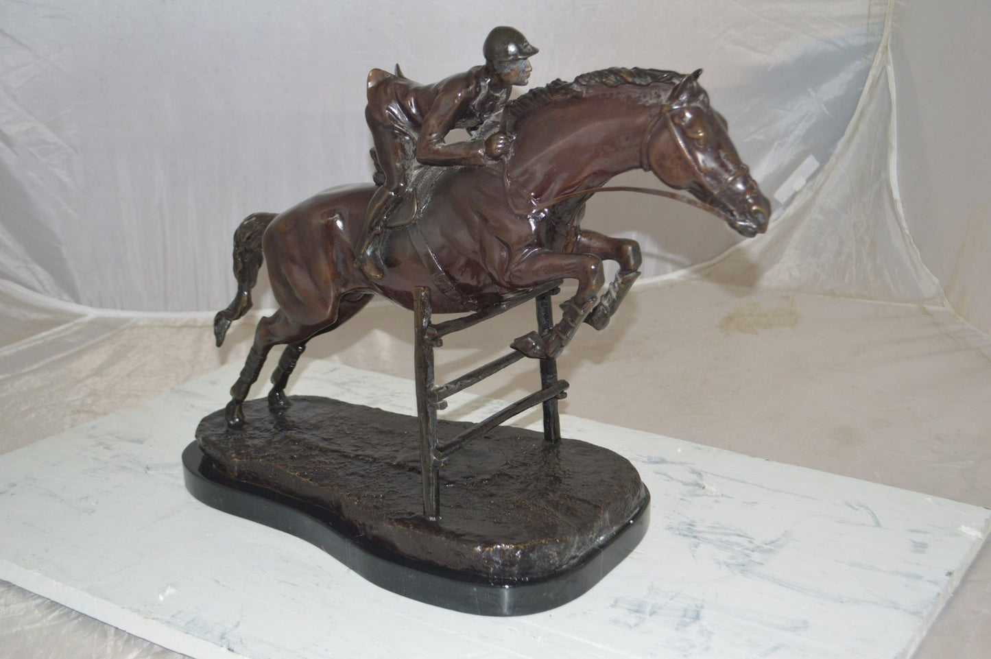 Jockey With Horse Jumping Over Hurdle Bronze Statue Medium  23"L x 10"W x 16"H.