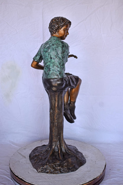 Boy Sitting on A Log with His Puppy Bronze Statue - Size: 15"L x 15"W x 35"H.