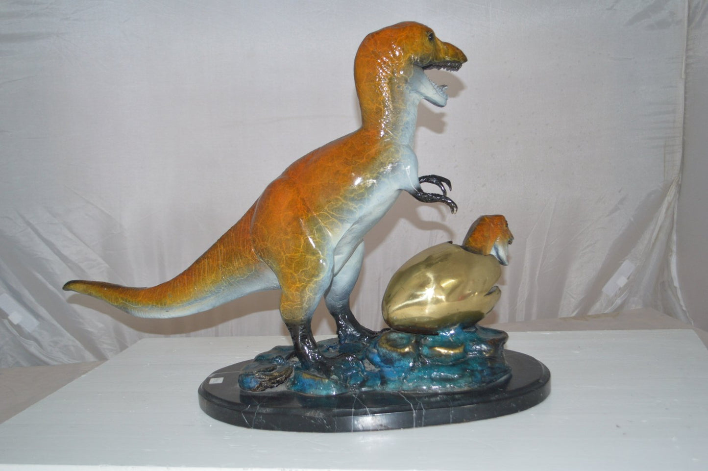 Dinosaur and baby Dino Bronze Statue -  Size: 26"L x 11"W x 18"H.