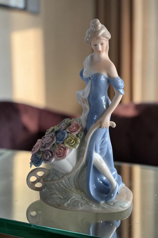Porcelain Lady Blue Gown Pushing Rose Wheelbarrow Statue 8"x4"x14"H