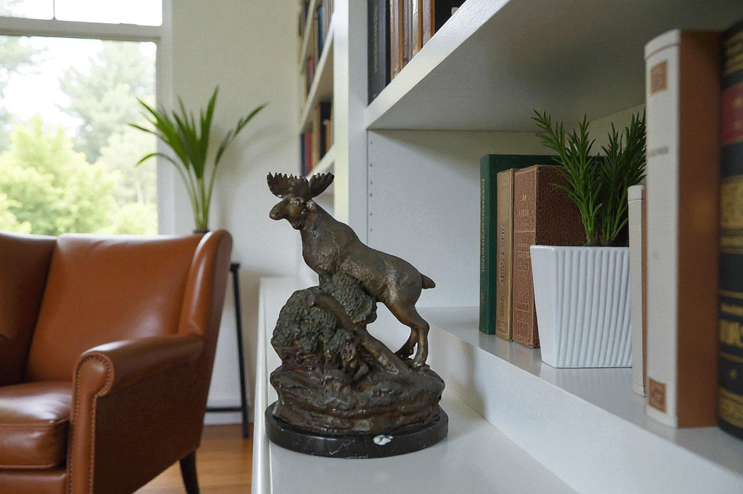 Moose on a rock bronze statue - Size: 9"L x 7"W x 14"H.