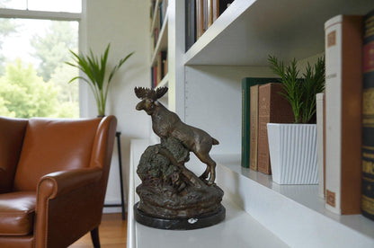 Moose on a rock bronze statue - Size: 9"L x 7"W x 14"H.