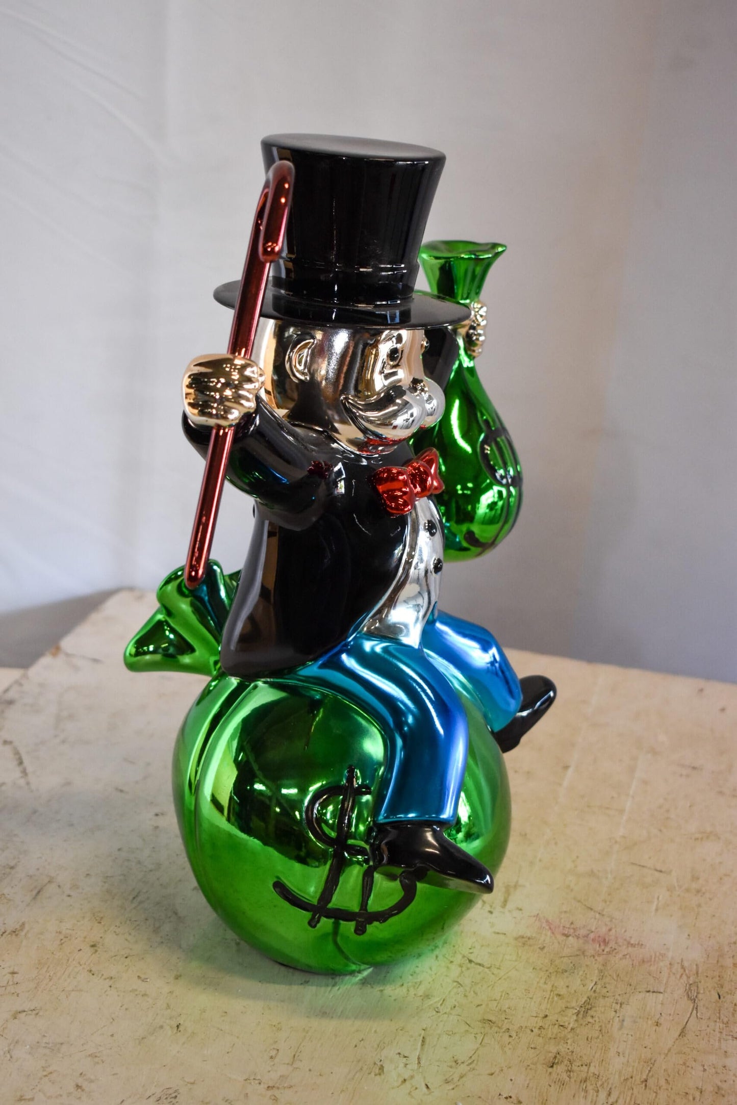 Joyous Monopoly Man Sitting on Money Bag Resin Statue 12" x 10" x 16"H