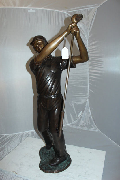 Teen boy plays golf Bronze Statue -  Size: 18"L x 13"W x 57"H.