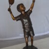 Boy Playing Tennis Bronze Statue -  Size: 12"L x 8"W x 25"H.