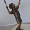 Boy Playing Tennis Bronze Statue -  Size: 12"L x 8"W x 25"H.