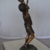 Boy Playing Tennis Bronze Statue -  Size: 12"L x 8"W x 25"H.