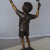 Boy Playing Tennis Bronze Statue -  Size: 12"L x 8"W x 25"H.