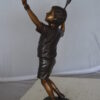 Boy Playing Tennis Bronze Statue -  Size: 12"L x 8"W x 25"H.