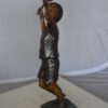 Boy Playing Tennis Bronze Statue -  Size: 12"L x 8"W x 25"H.