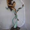 Beautiful Young Girl Sitting on a Tree Bronze Statue -  35"L x 50"W x 55"H.