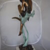 Beautiful Young Girl Sitting on a Tree Bronze Statue -  35"L x 50"W x 55"H.