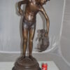 Boy holding a Dog and a Bird Bronze Statue -  Size: 15"L x 15"W x 36"H.