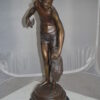 Boy holding a Dog and a Bird Bronze Statue -  Size: 15"L x 15"W x 36"H.