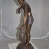 Boy holding a Dog and a Bird Bronze Statue -  Size: 15"L x 15"W x 36"H.