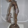 Boy holding a Dog and a Bird Bronze Statue -  Size: 15"L x 15"W x 36"H.